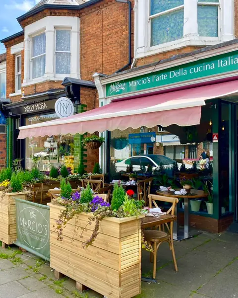 Marcio’s shopfront on Castle Road, with planters and the front terrace