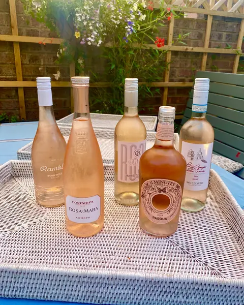 Bottles of rosé on a garden table