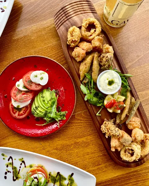 Caprese with avocado and a board of fritto misto
