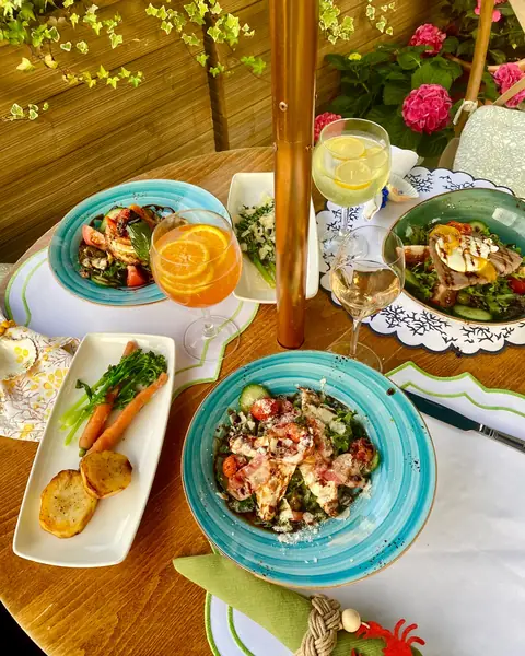 Plates and fresh juice on a garden table